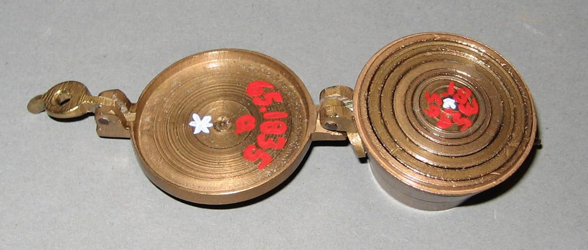 1965.1835 Weight Case and Weights (detail)