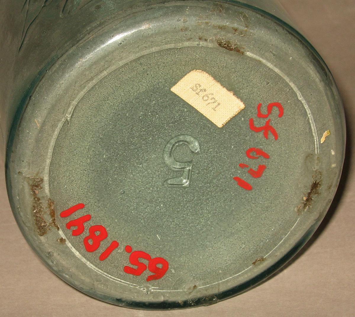 1965.1891 Glass jar (underside)