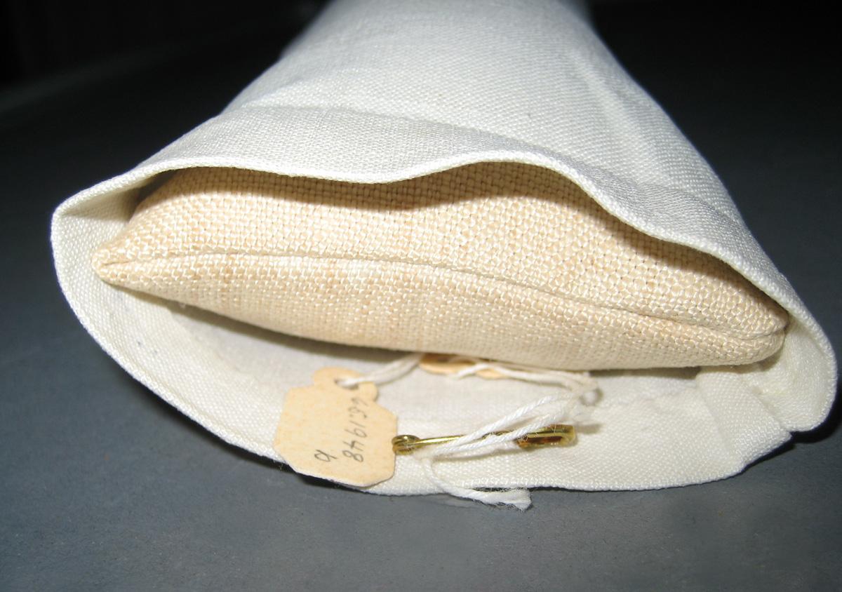 1965.1948 B miniature pillow and 1965.1948 C miniature pillow cover detail