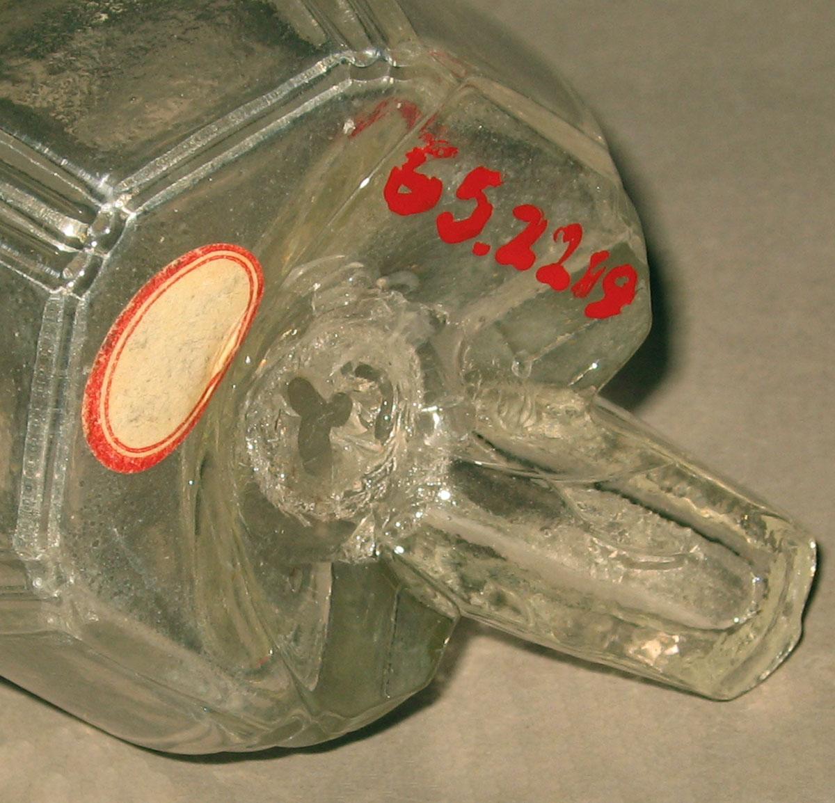 1965.2219 Glass bird feeder (underside)