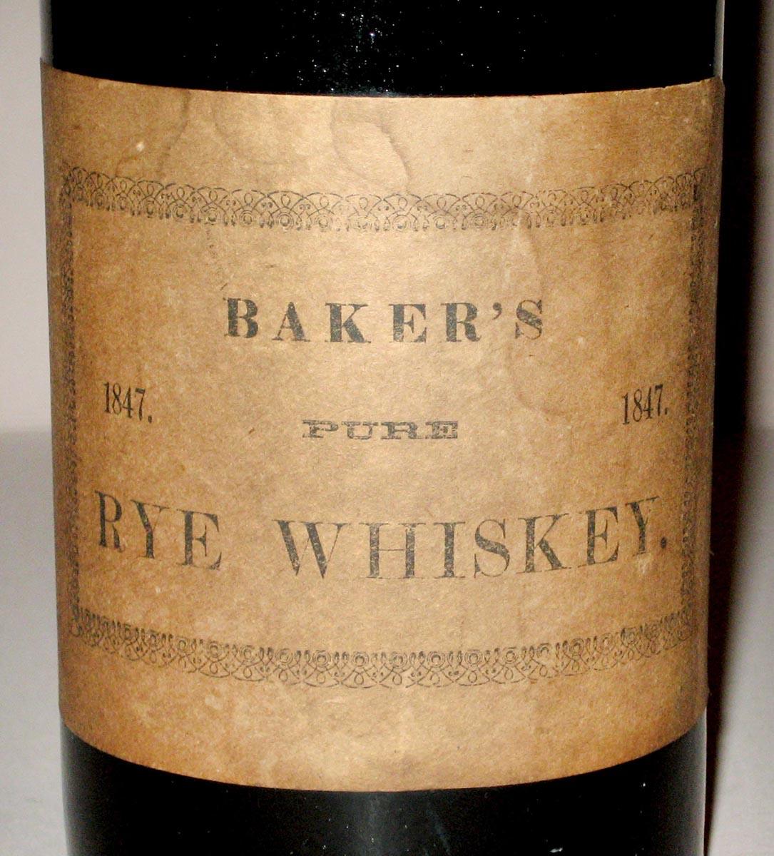 1965.2233 Whiskey or wine bottle (label 1)