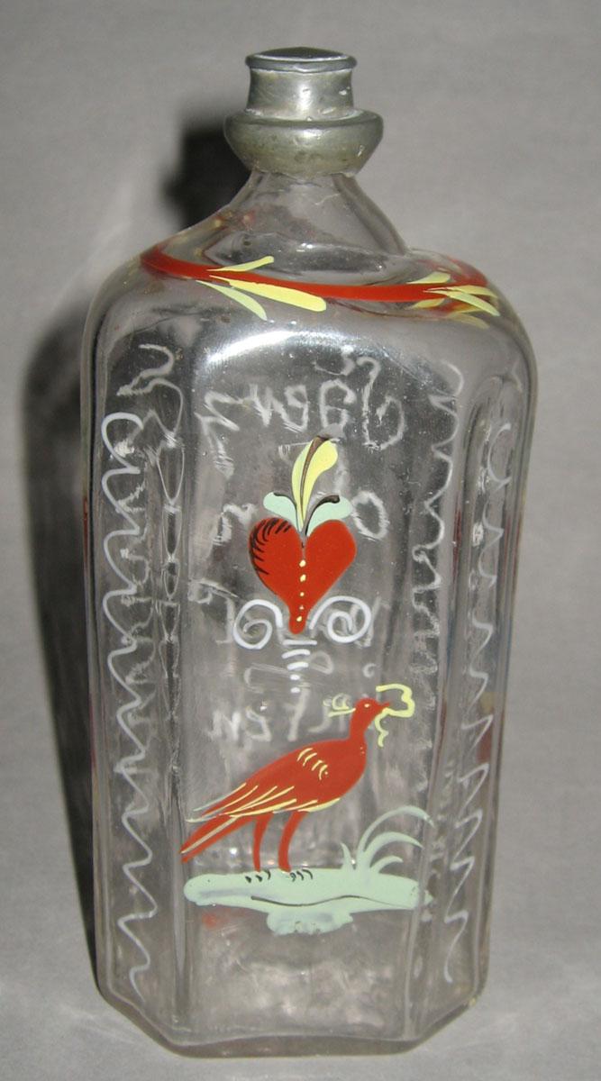 1965.2276 Glass bottle (side 2)