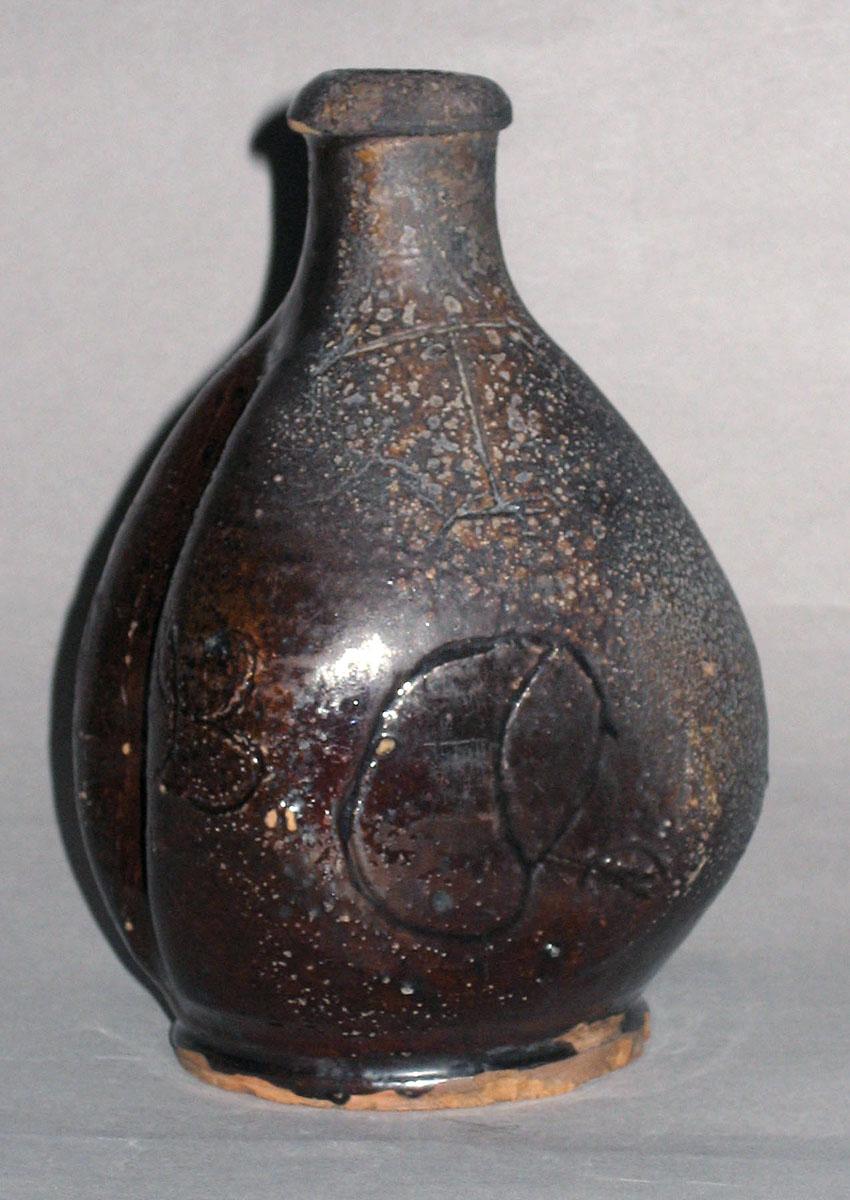 1965.2310 (side 2) Bottle