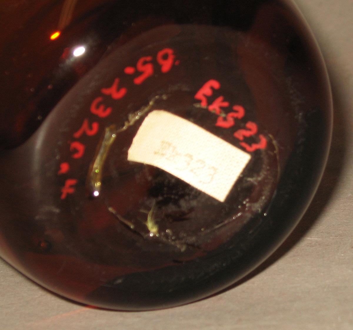 1965.2320.004 Amber glass tumber (underside)