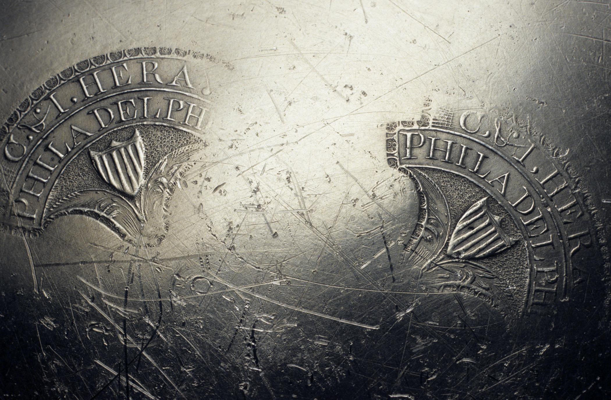 1965.2458 Pewter plate (marks)