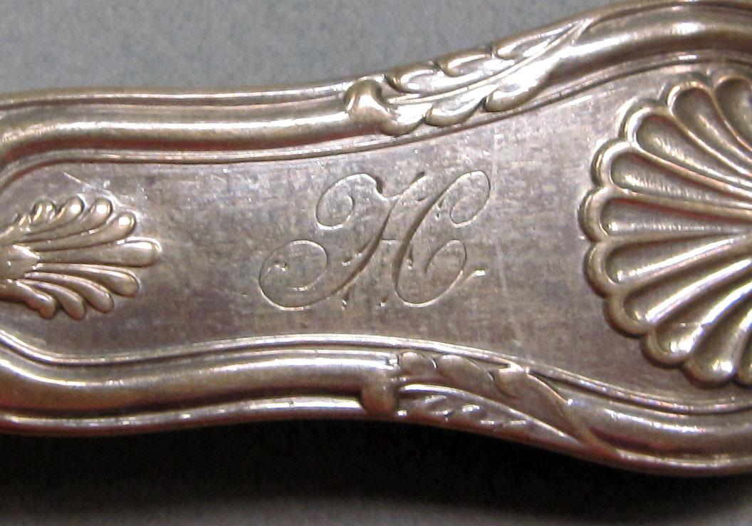 1965.3058 Silver spoon engraving