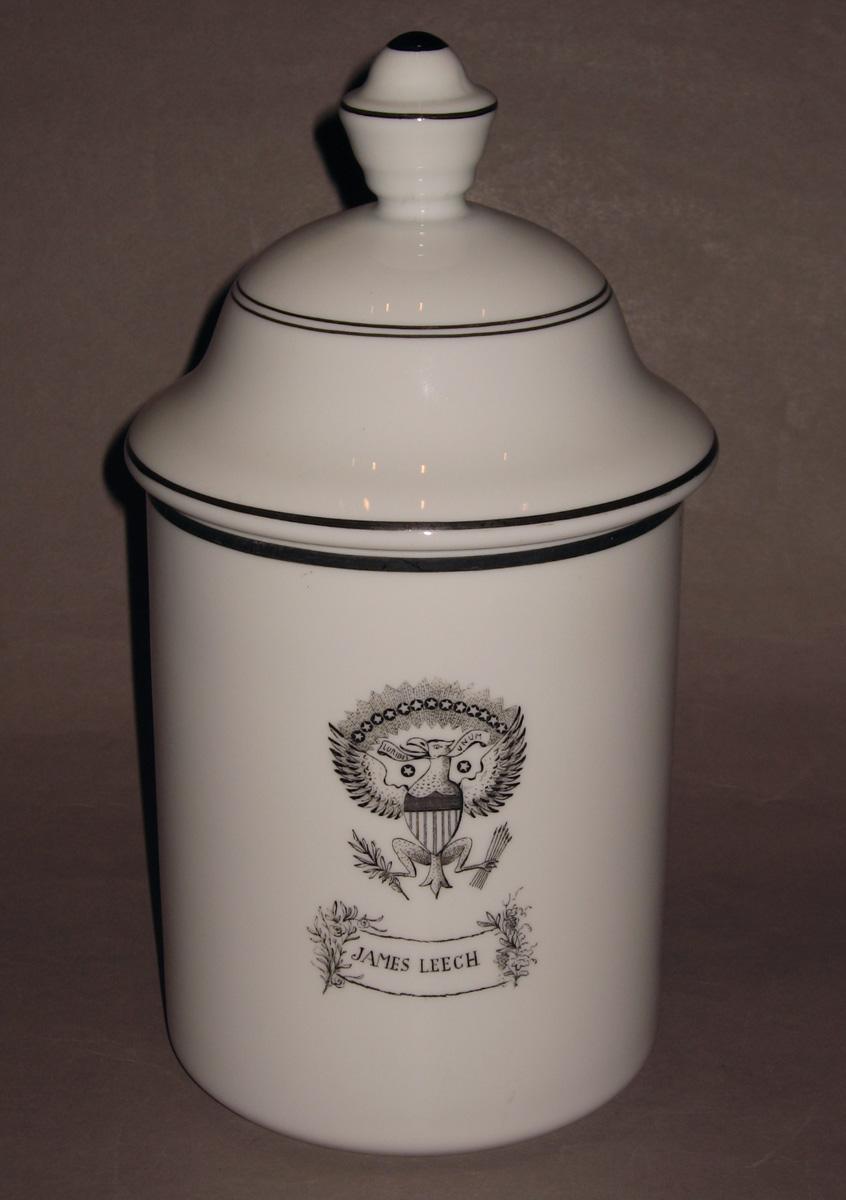 1966.0037 A, B White glass jar (reverse)