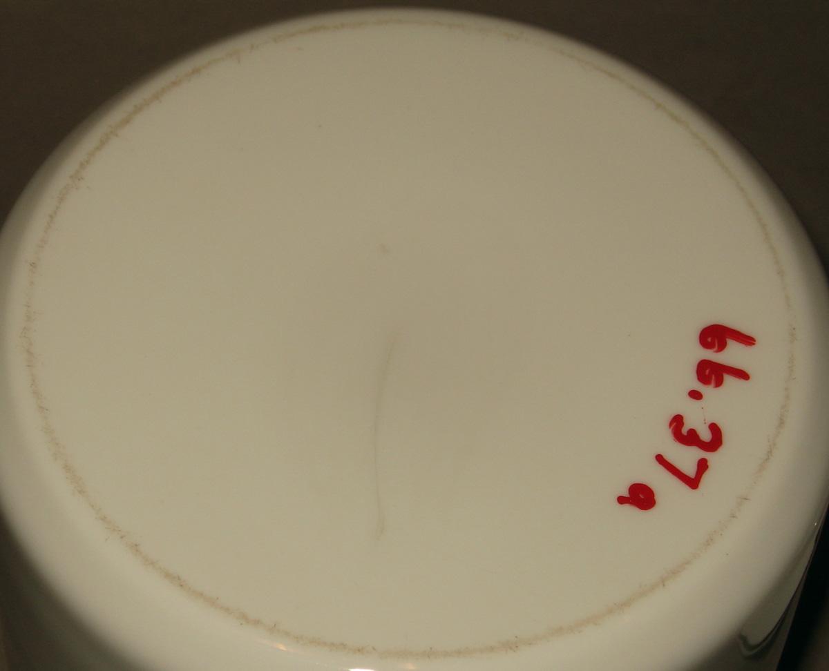 1966.0037 A, B White glass jar (underside)