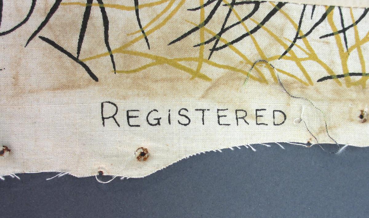 1952.0174 B Textile, woven inscription 1