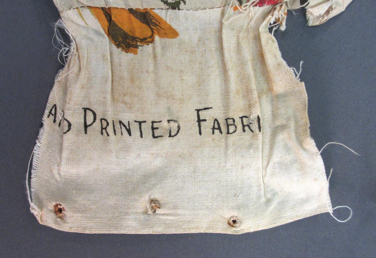 1952.0174 B Textile, woven inscription 2