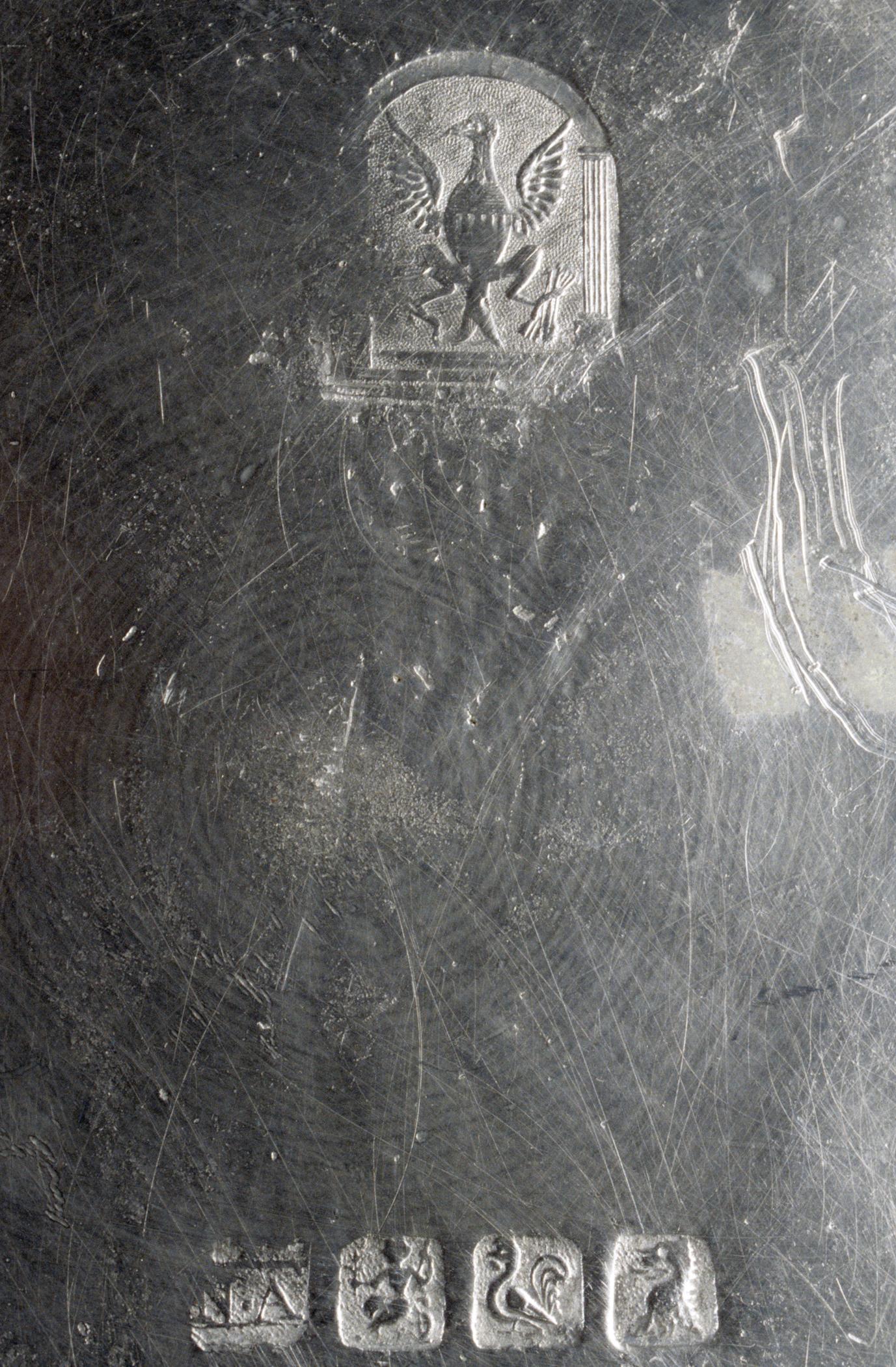 1956.0046.011 Pewter dish (marks)