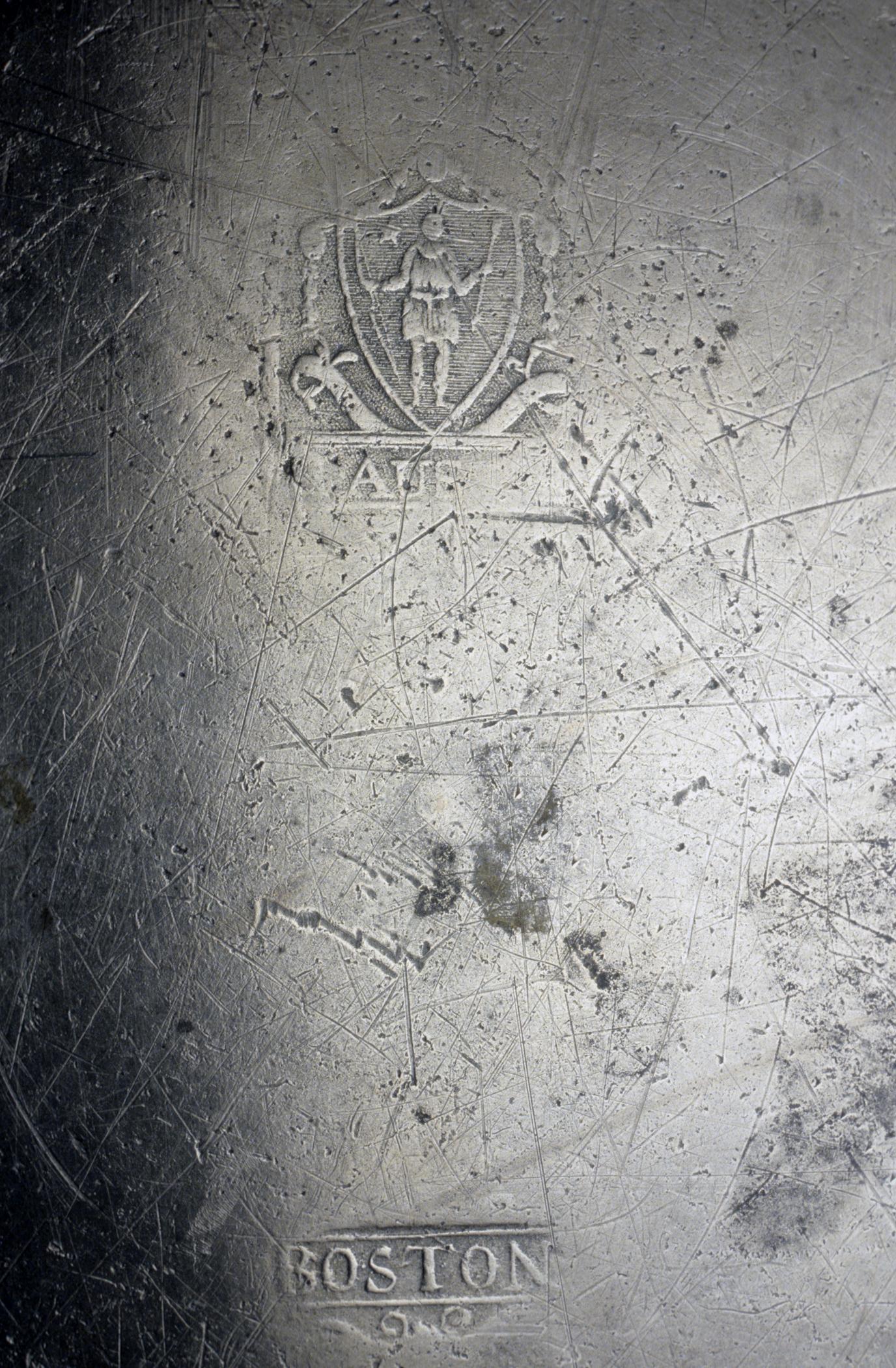 1956.0046.012 Pewter dish (marks)