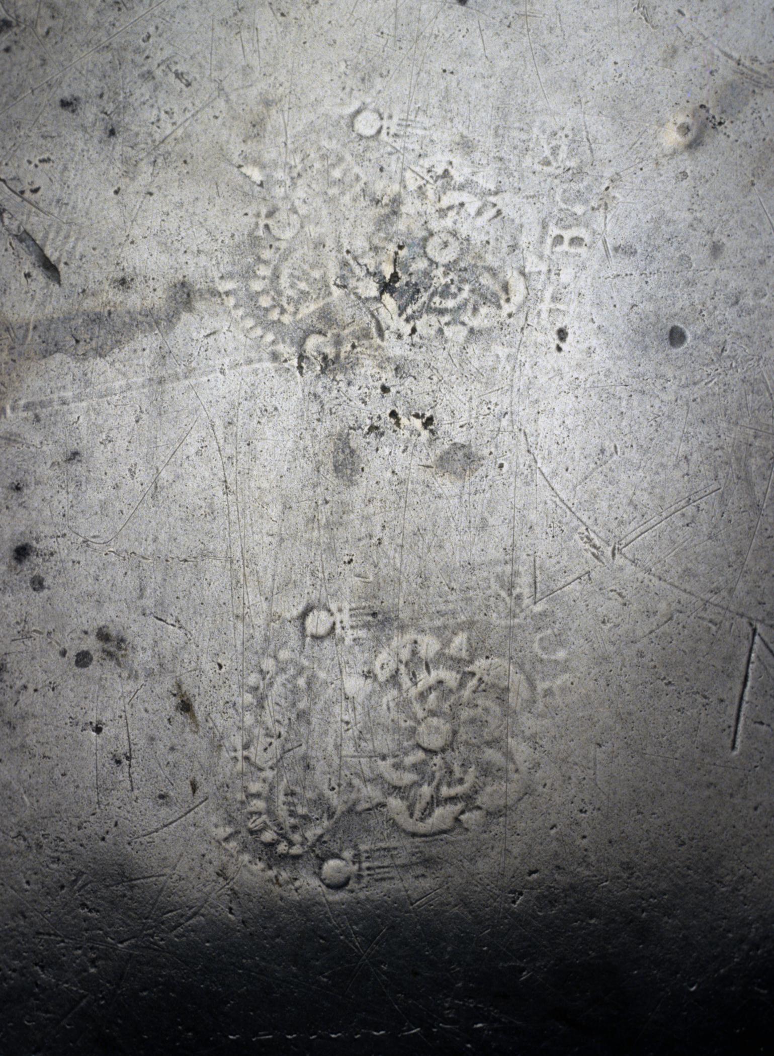 1956.0046.013 Pewter dish (marks)