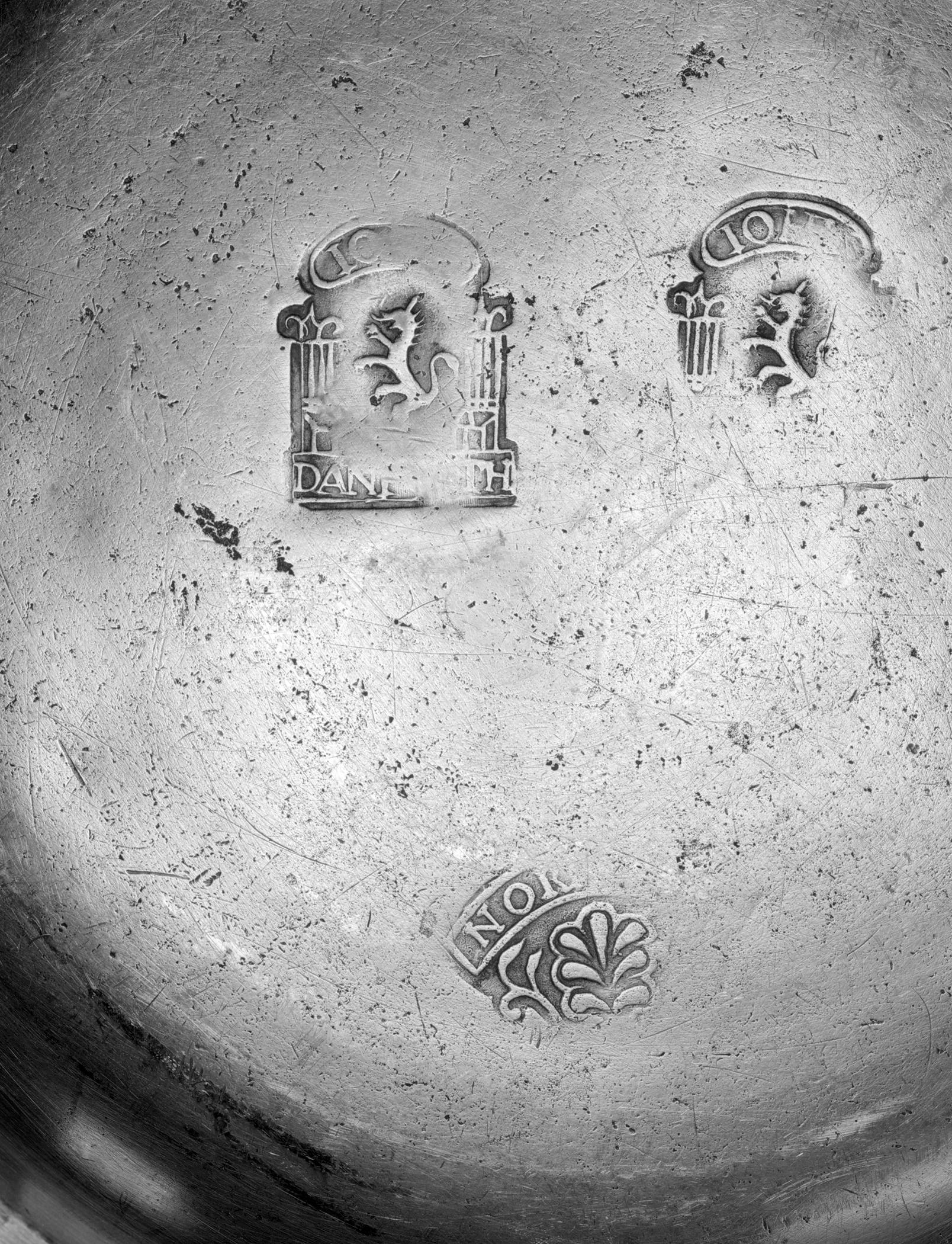 1956.0046.015 Pewter plate (marks)