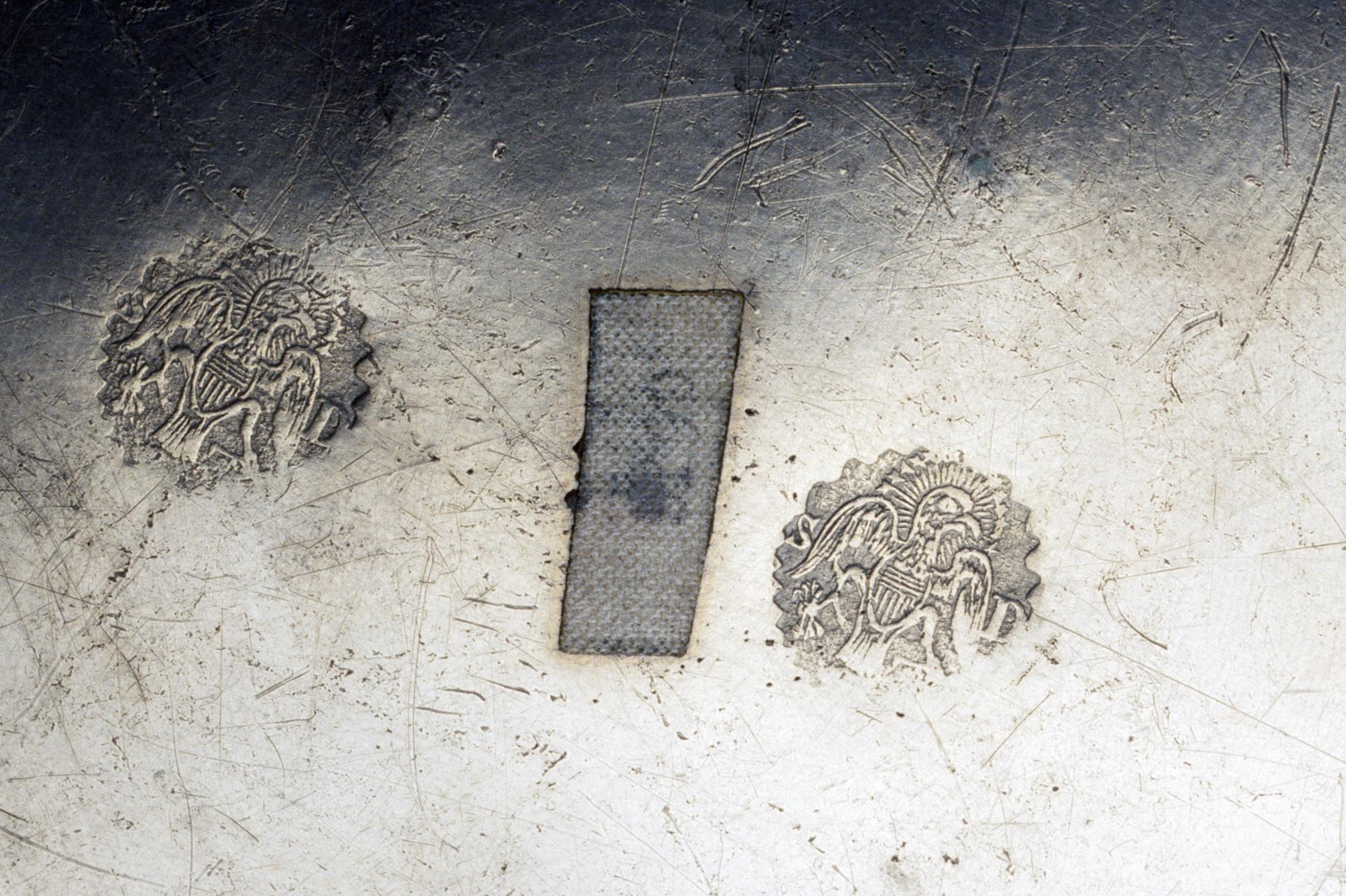 1956.0046.019 Pewter plate (marks)