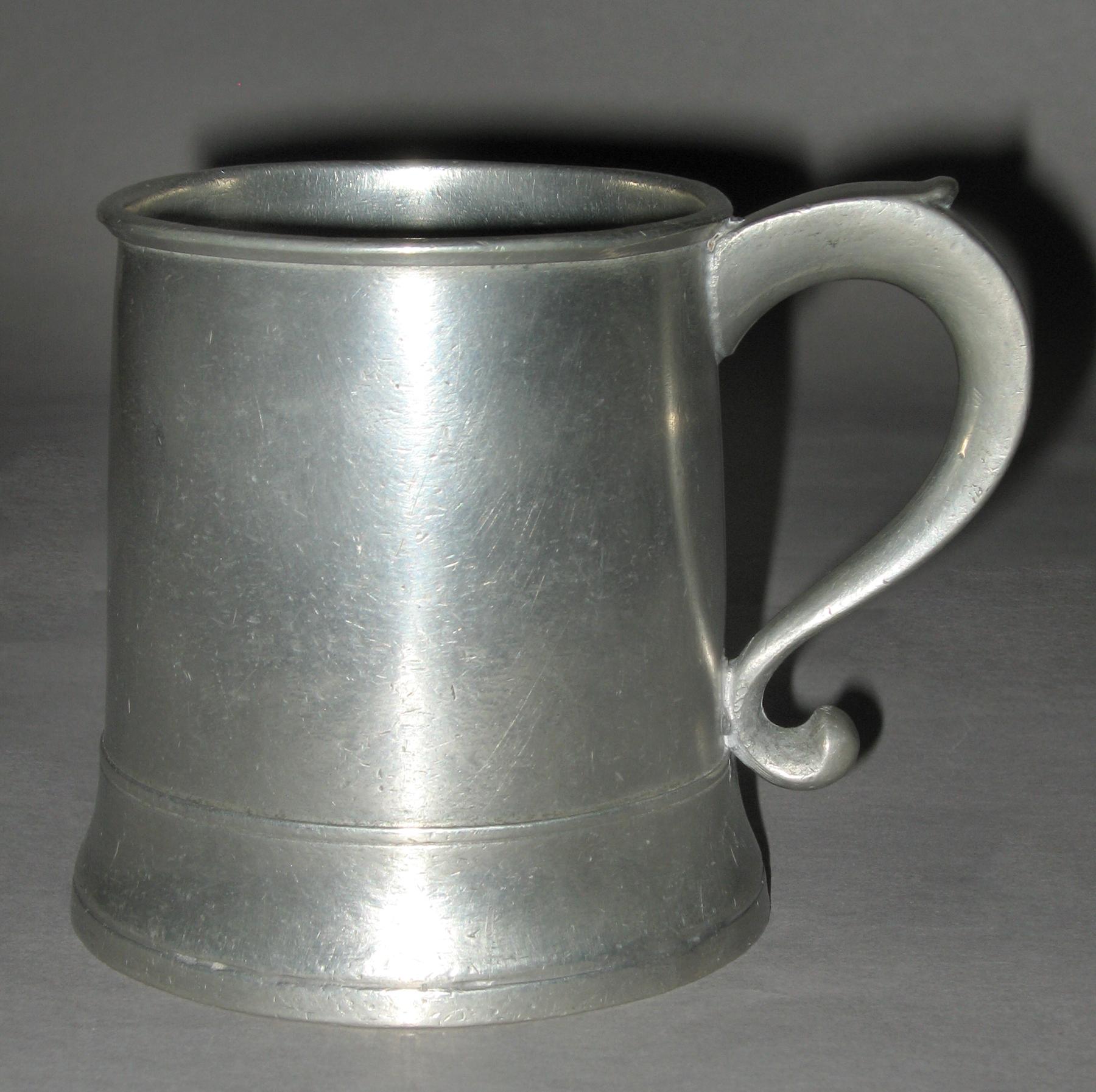 1956.0046.020 Pewter mug (side 2)