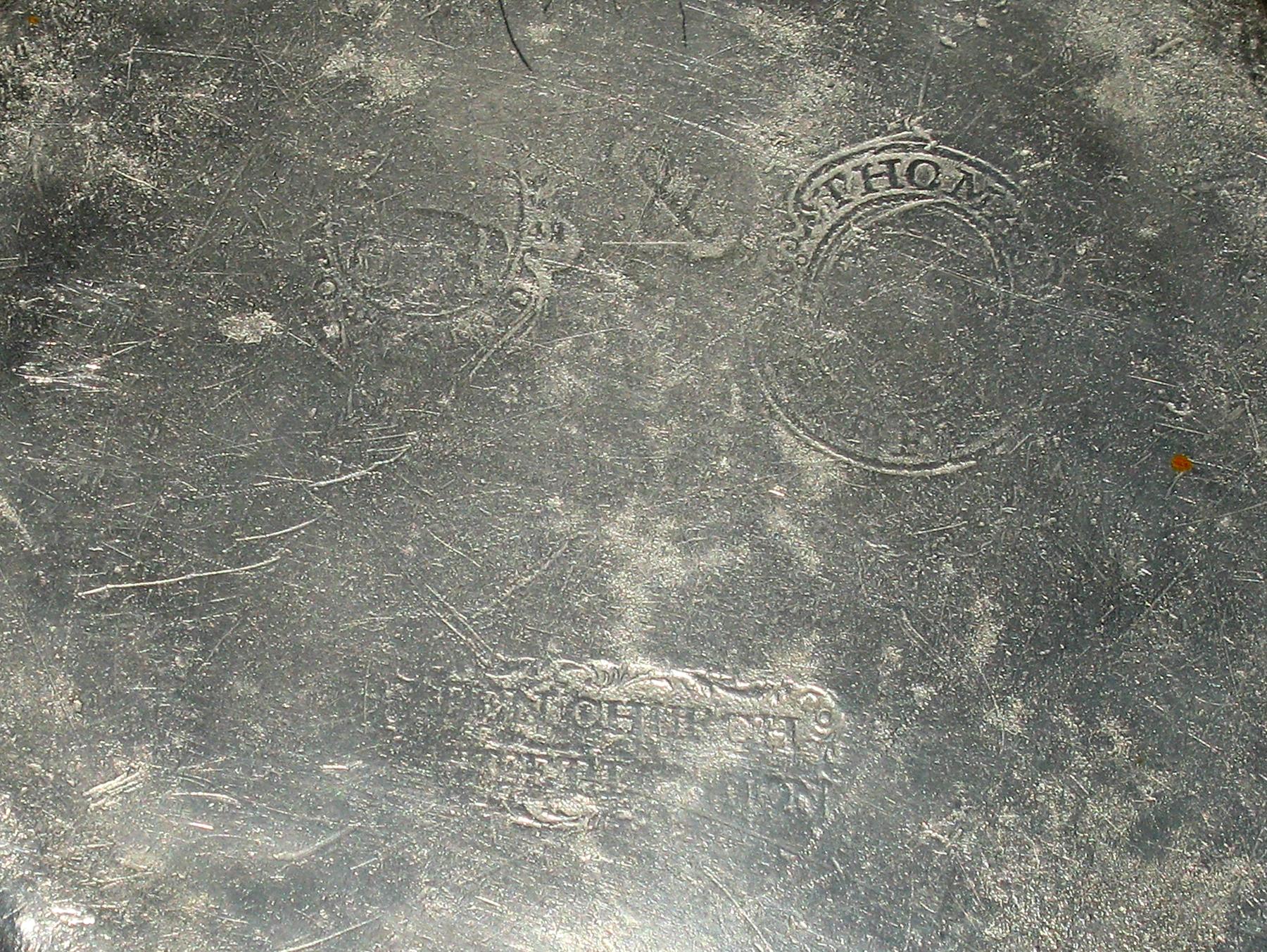 1956.0059.011 Pewter plate (marks)