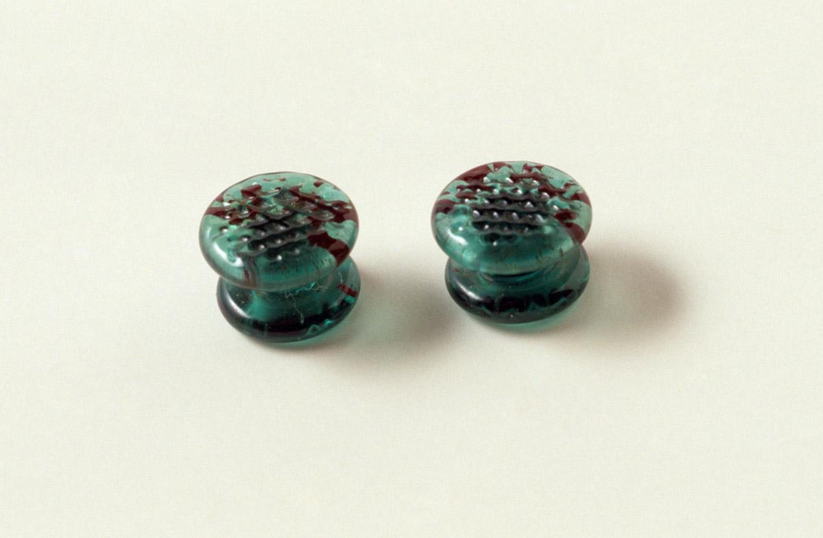 1956.0099.001, .002 Green glass studs