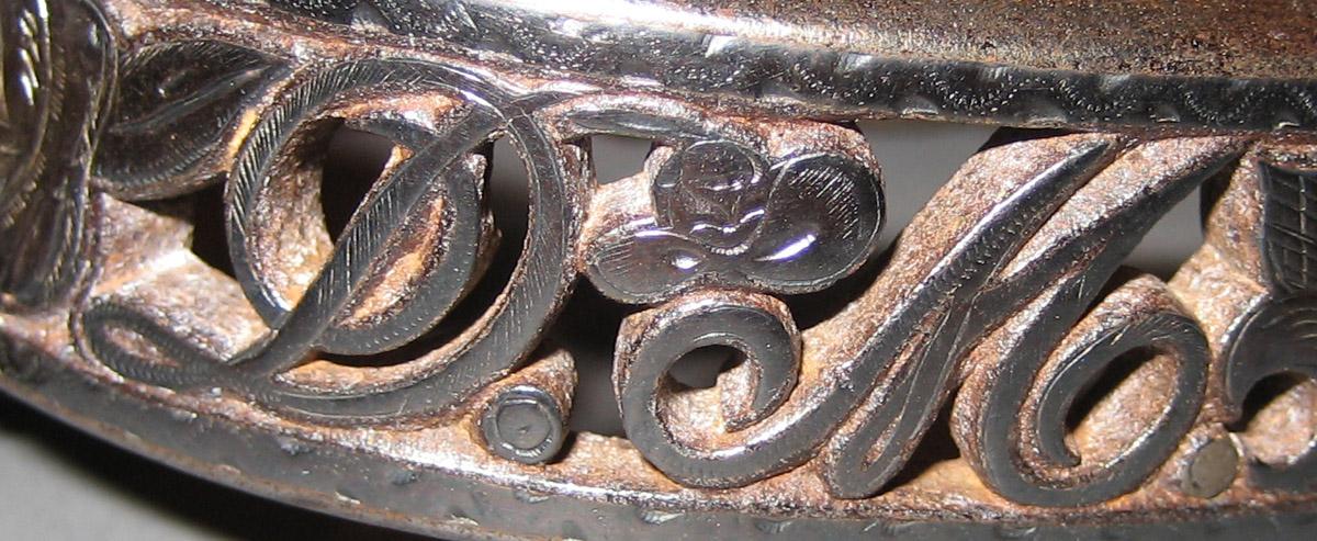 1956.0578 Spur (inscription)