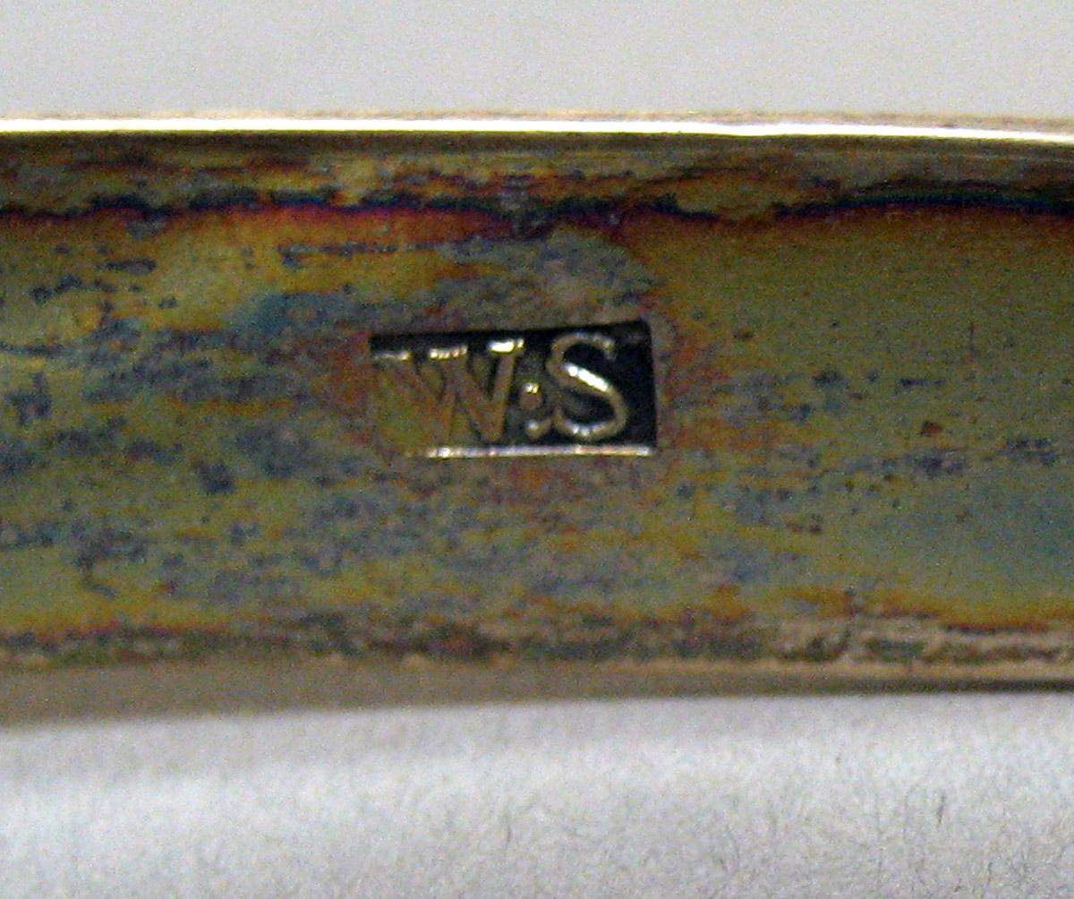 2006.0006.002 Silver Tongs mark 2
