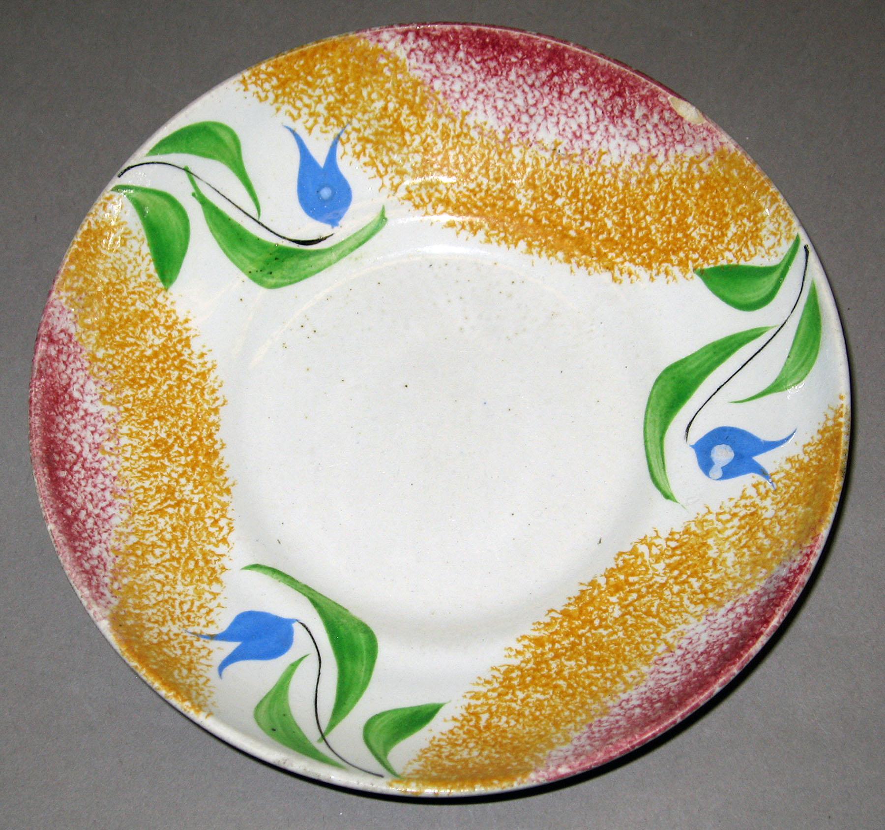 1957.0011 Spatterware saucer