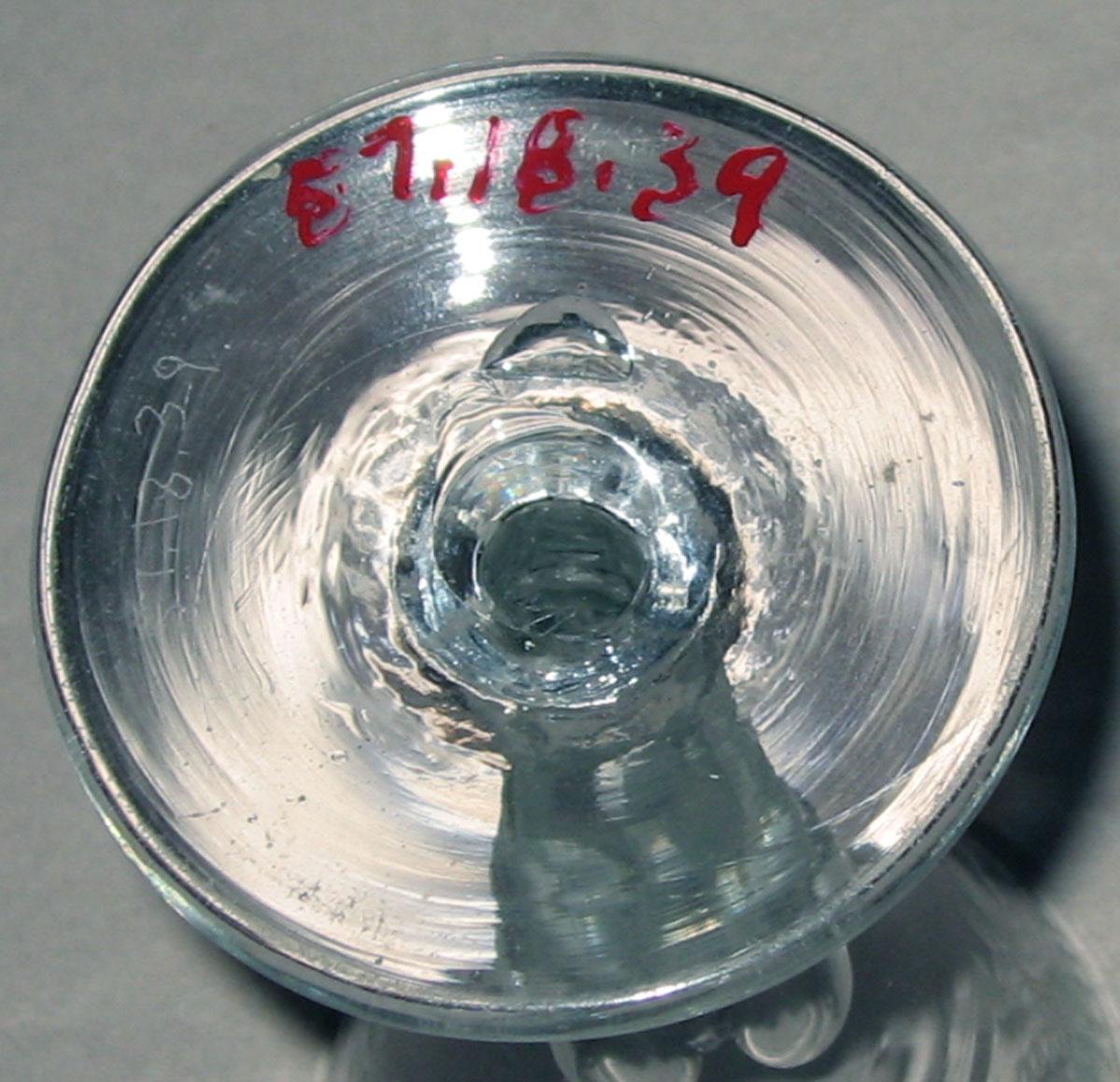 1957.0018.039  Colorless glass wineglass (underside)