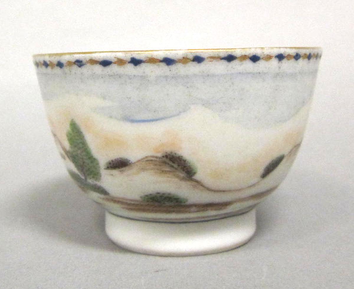 1966.0591.005 Porcelain teabowl face two