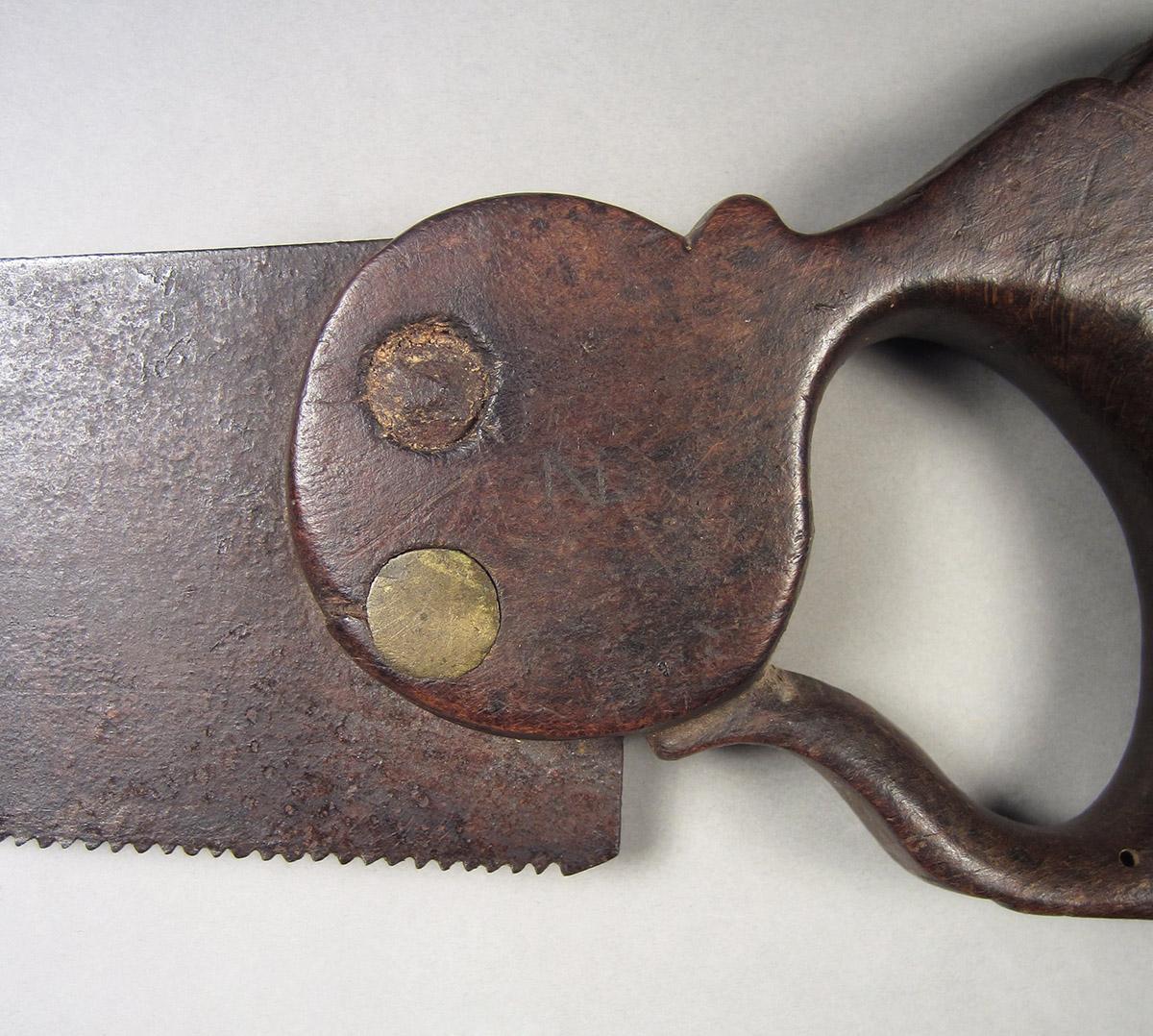 1957.0026.025, Hand saw, handle detail side 2