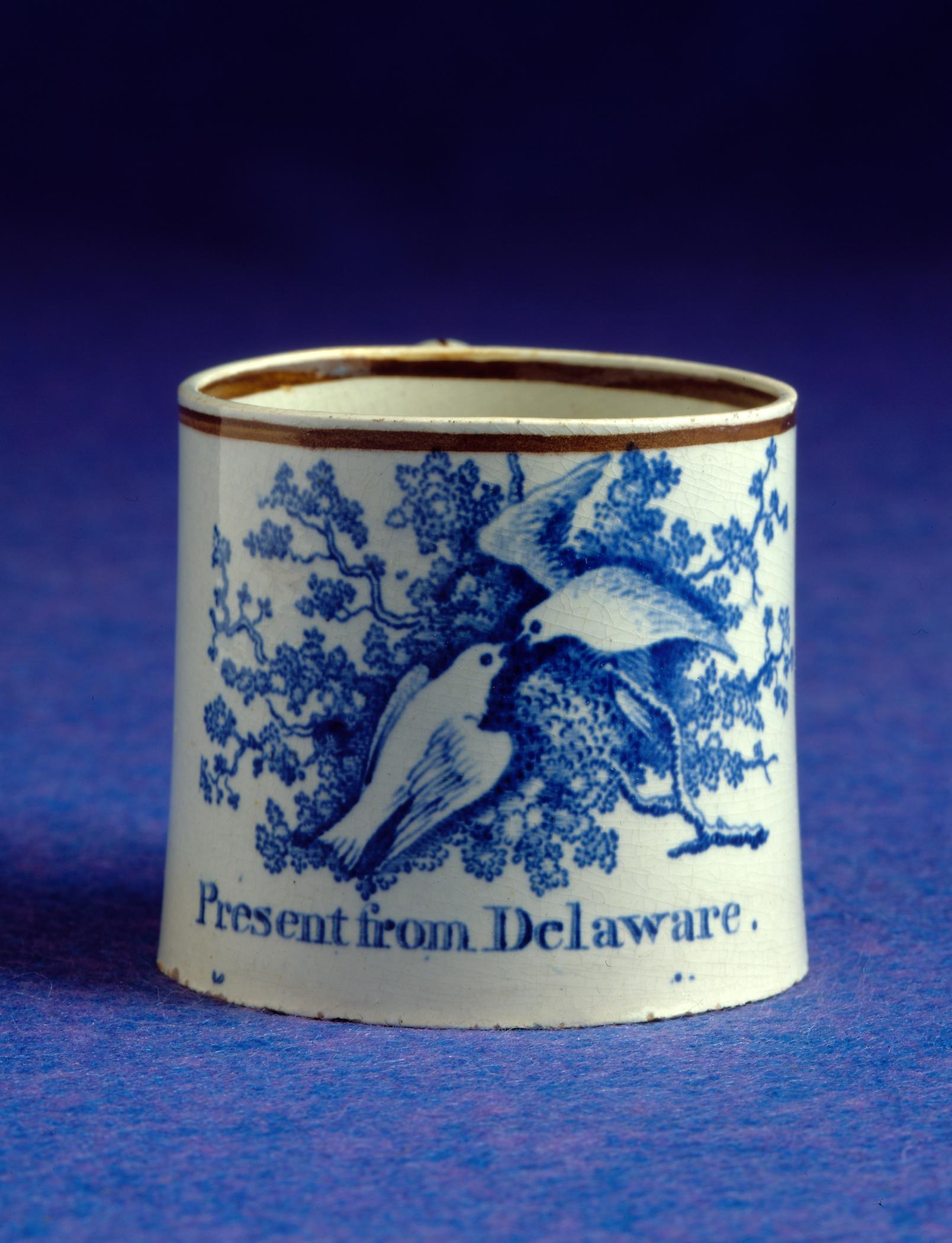 1966.0799 Pearlware "Present from Delaware" mug