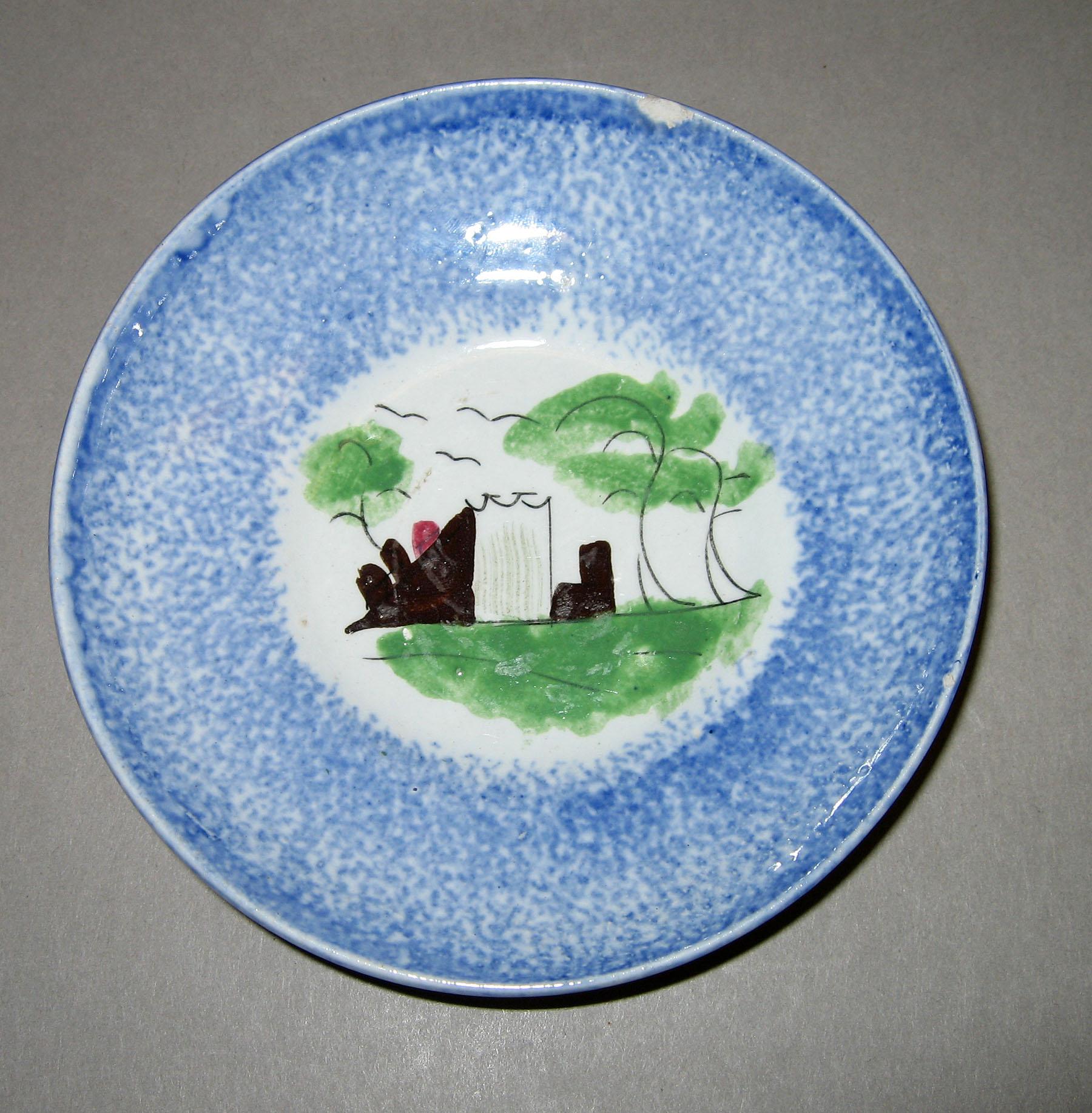 1966.1152.003 Fort or castle pattern blue spatterware saucer