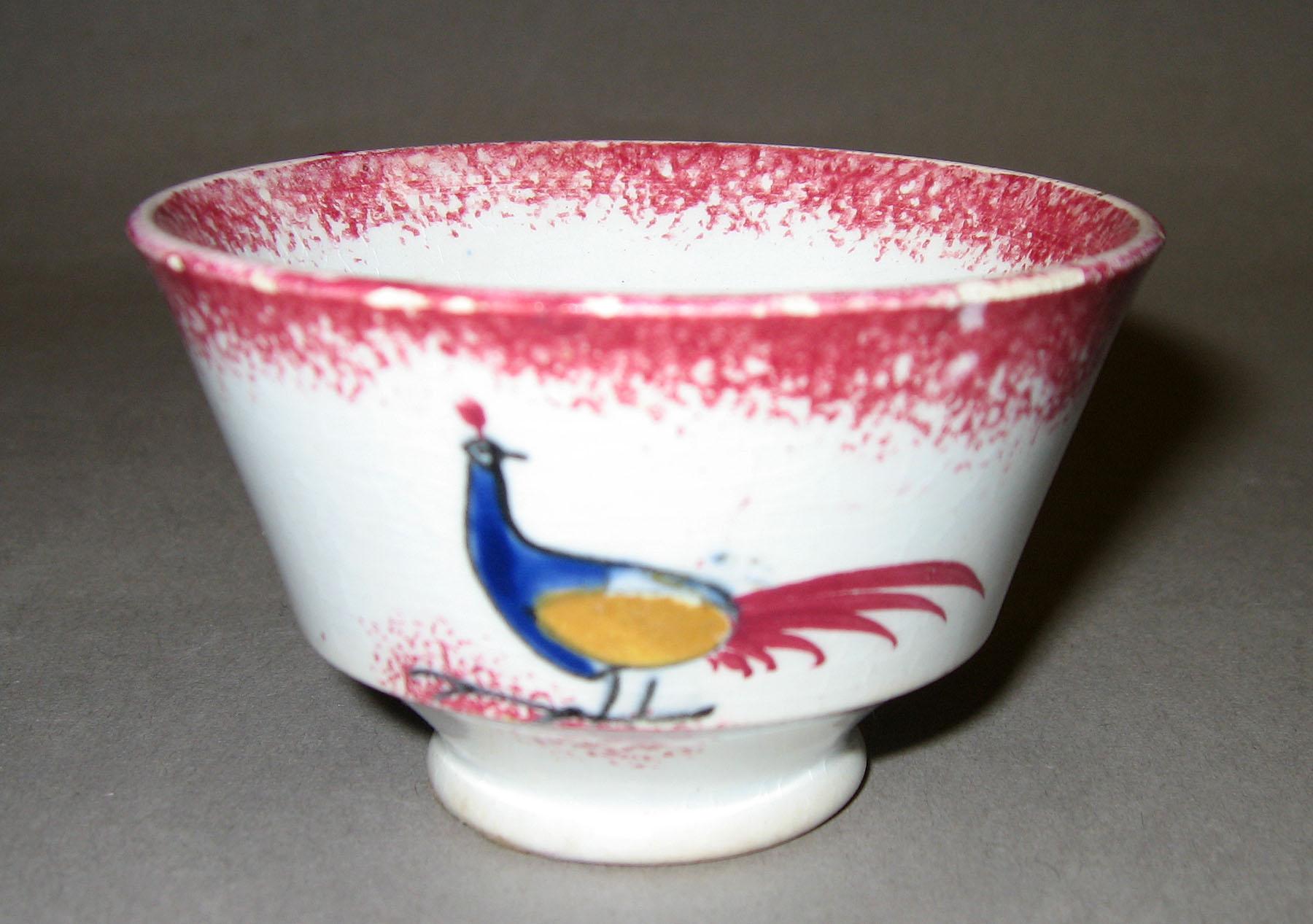 1966.1164 A Peafowl pattern spatter teabowl