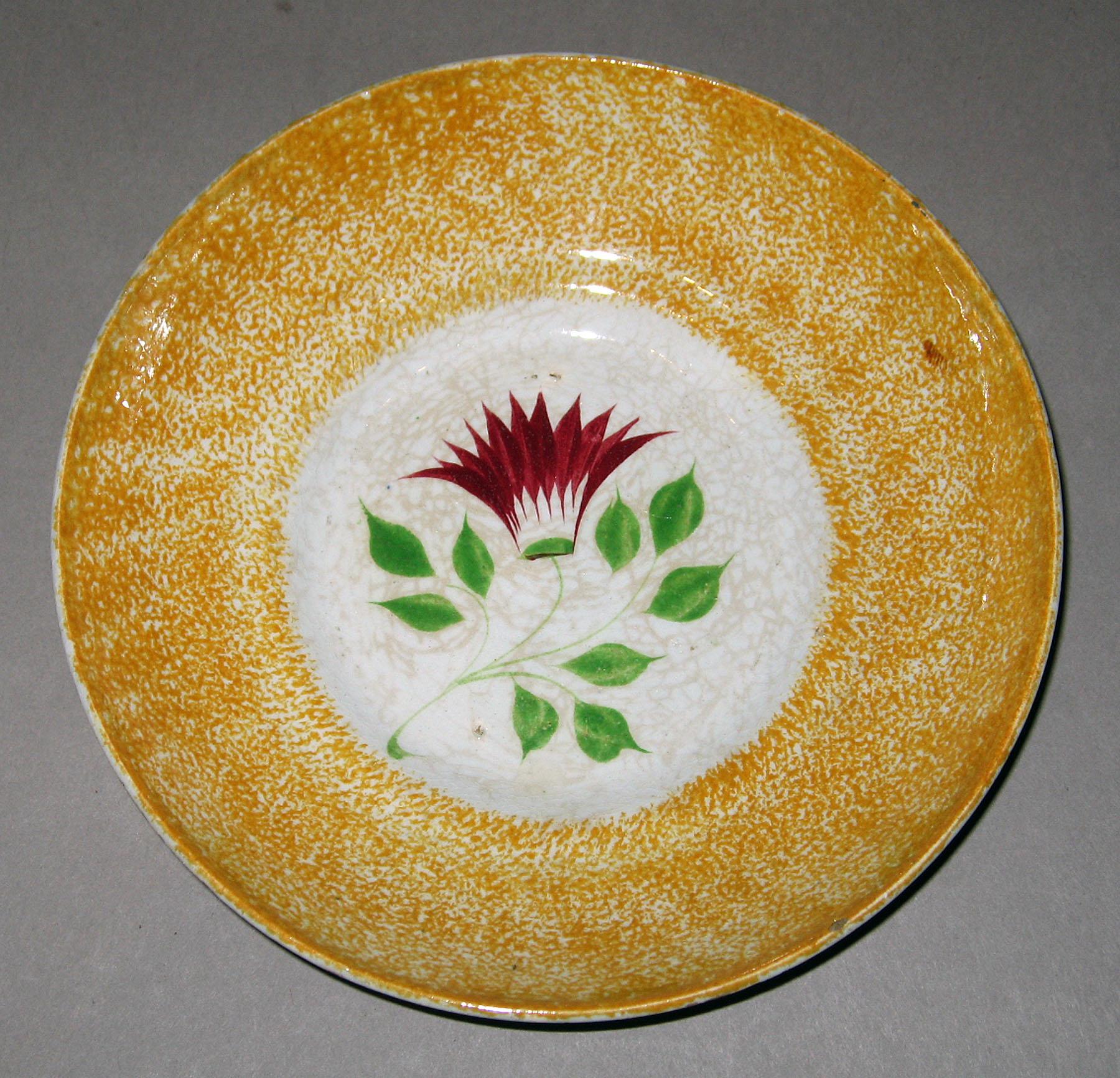 1966.1259 Spatterware saucer