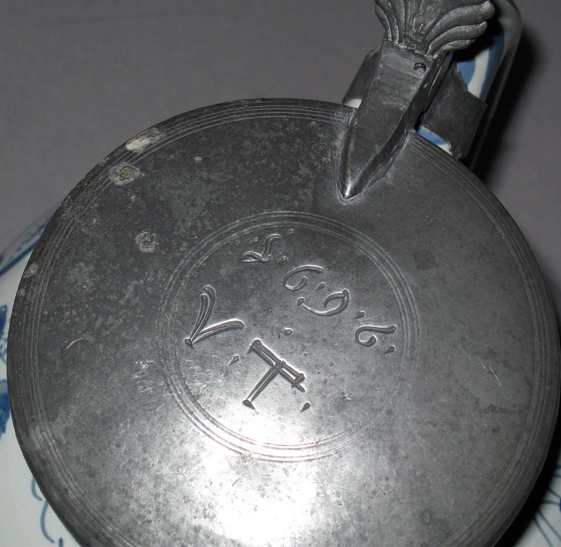 1966.1377 Delftware jug with metal cover (detail of cover)