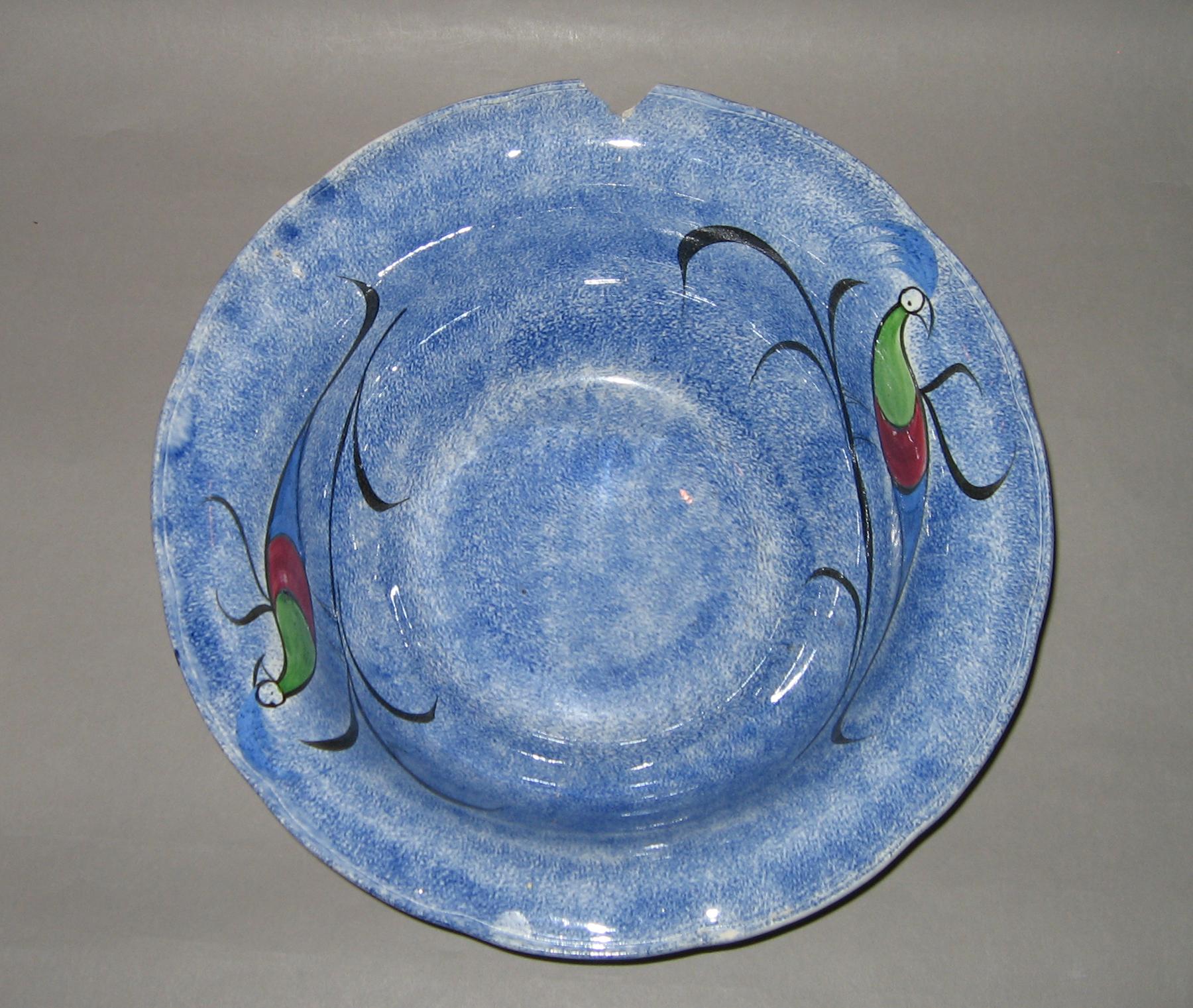 1967.0028 B Blue spatterware and peafowl bowl