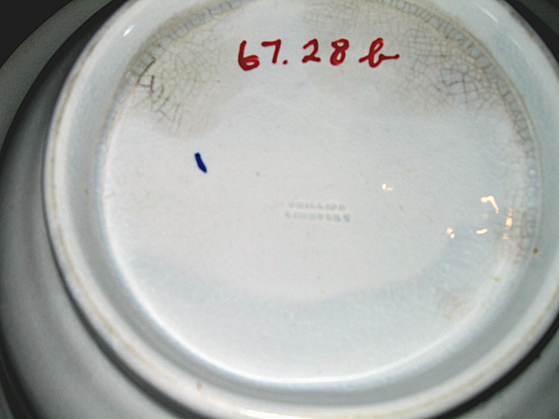 1967.0028 B Blue spatterware and peafowl bowl (mark)