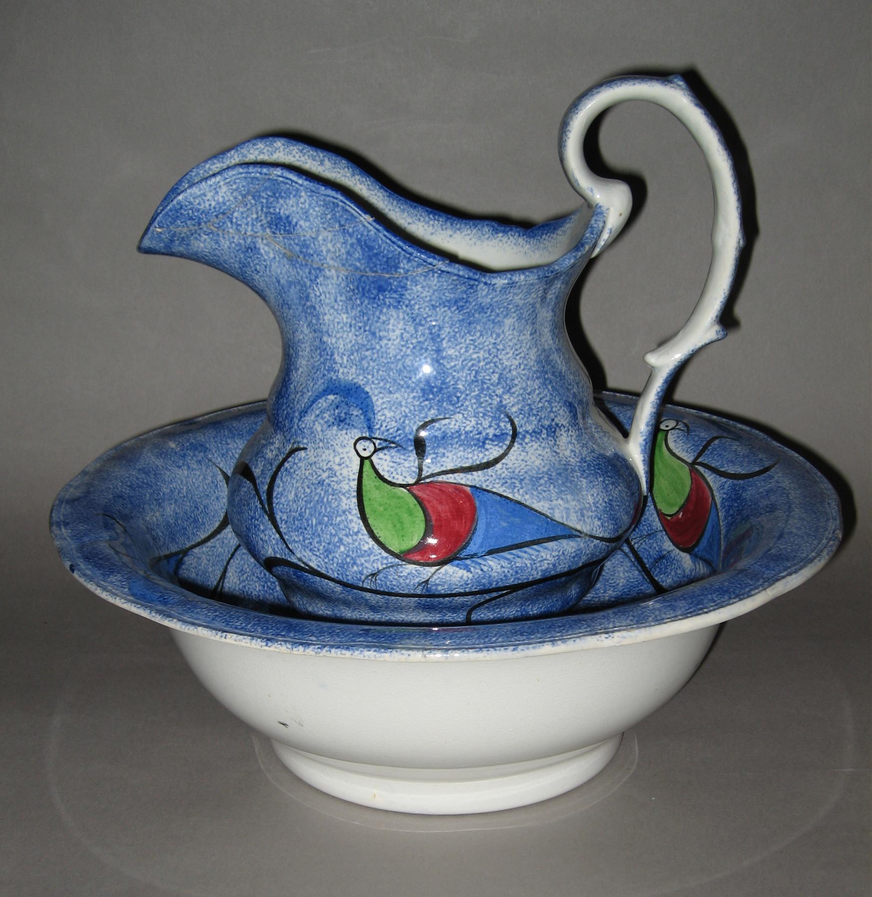 1967.0028 A, B Blue spatterware and peafowl bowl and pitcher