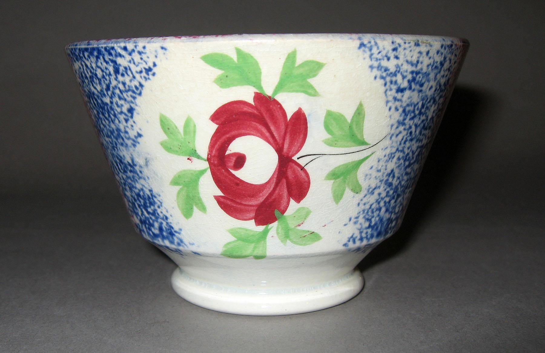 1967.0135 A Blue spatterware and adams rose pattern teabowl