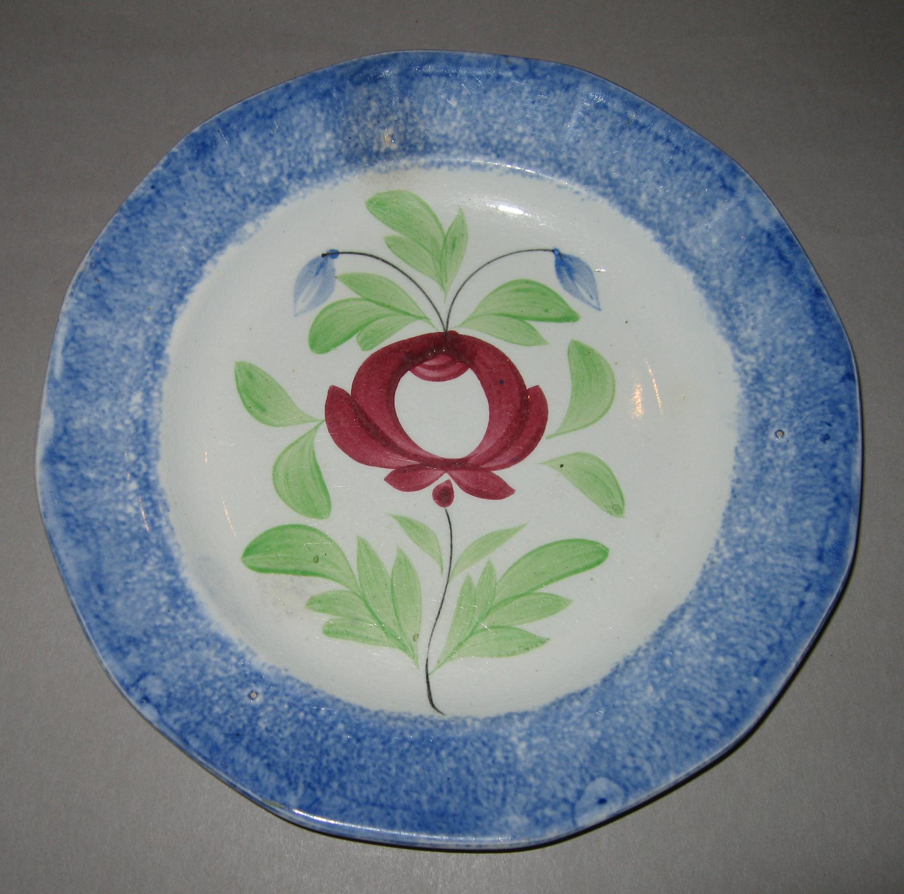 1967.0138 Blue spatterware and rose pattern plate