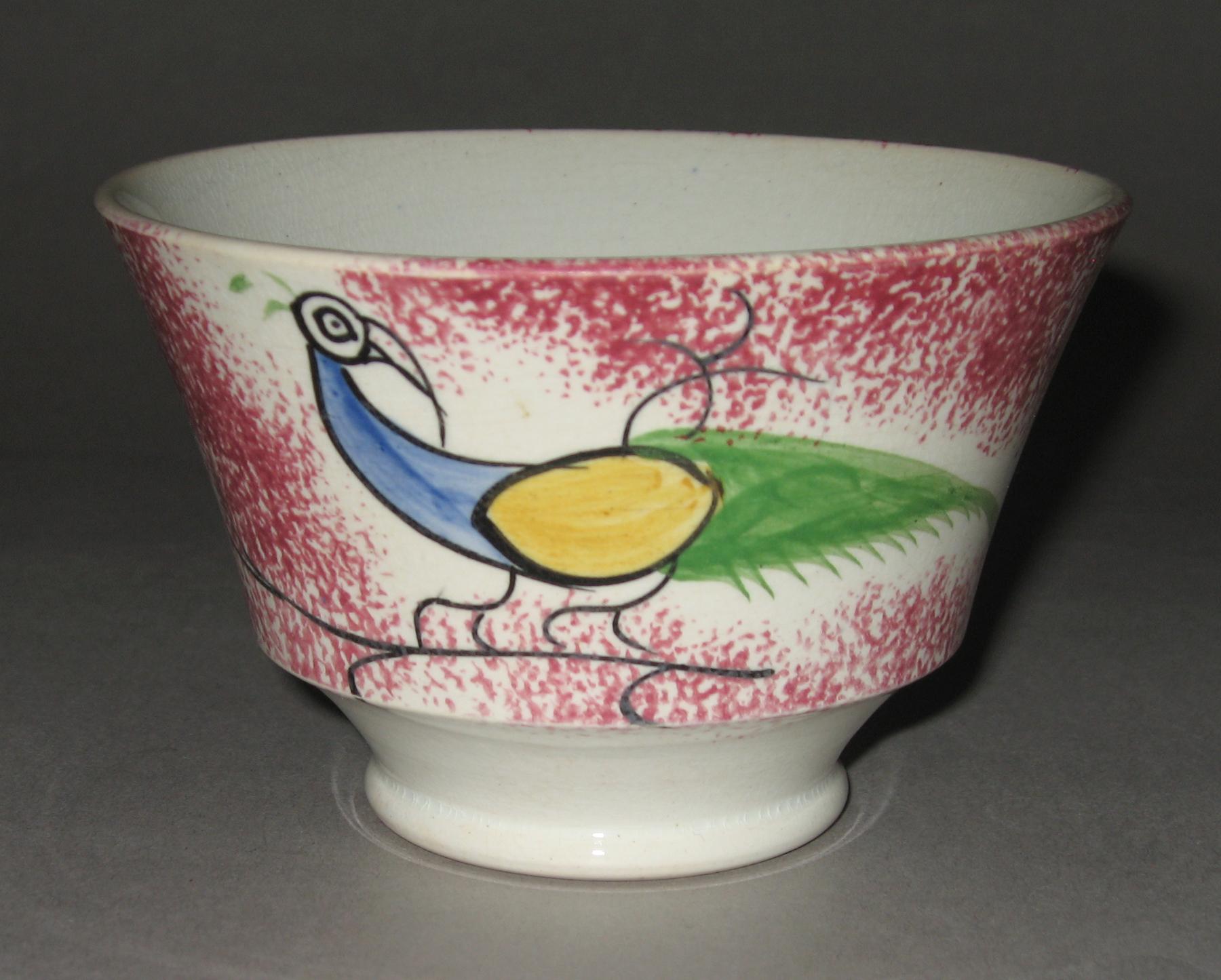 1967.0140 A Pink spatterware and peafowl teabowl