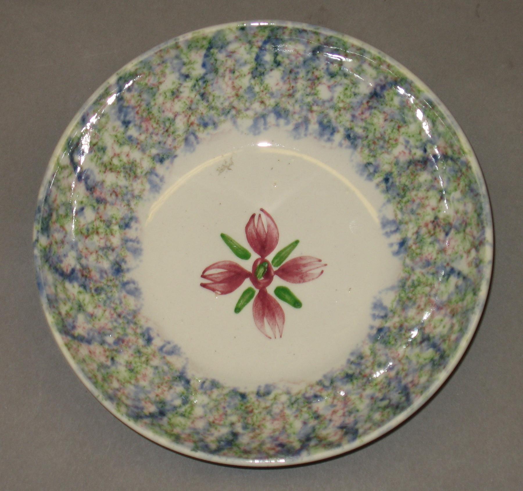 1967.0196 B Spatterware saucer