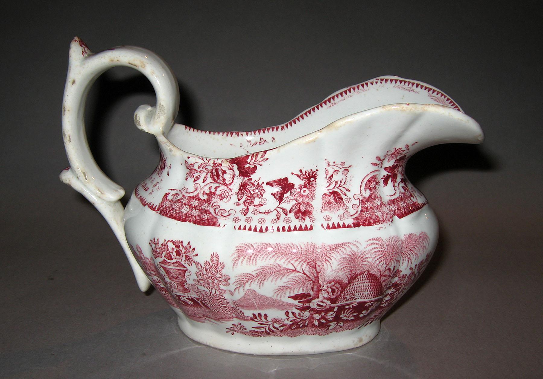 1967.0658 Transfer printed cream pot