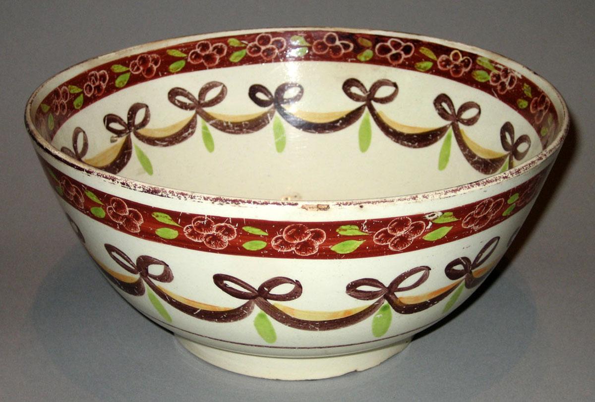 1967.0672 Creamware fish punch bowl, side