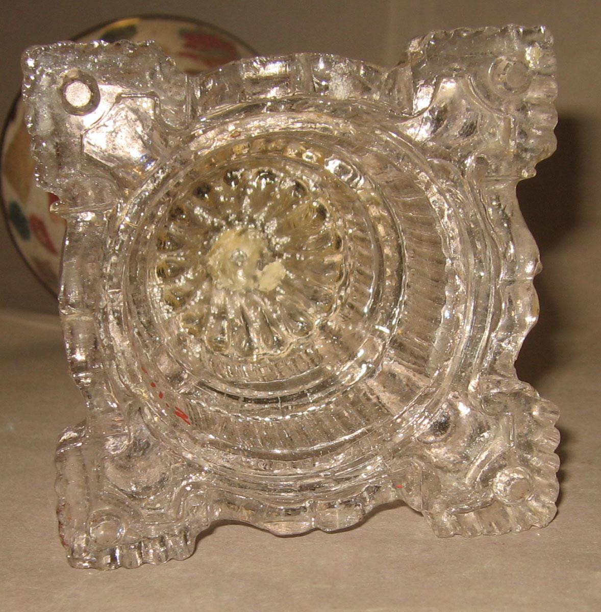 1967.0711.002 Glass oil lamp (underside of base)
