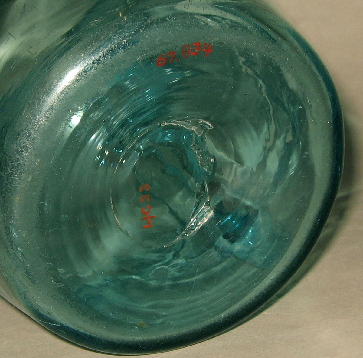 1967.0834  Glass jug (underside)