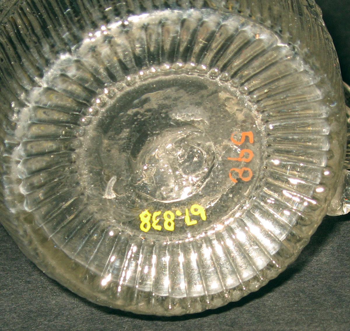 1967.0838 Glass jug (underside)