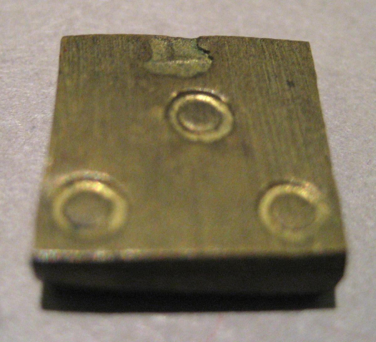 1967.1388 E Scale weight (recto)