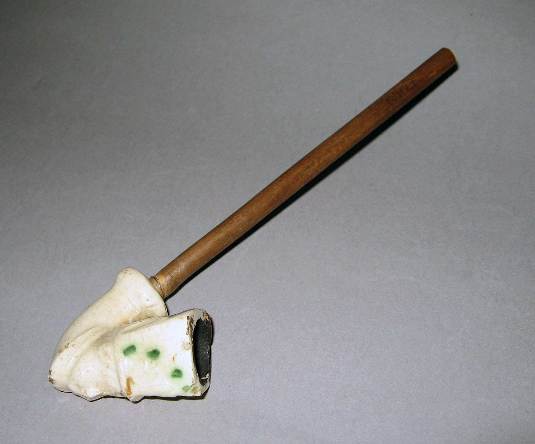 1967.1428 Creamware and bamboo pipe