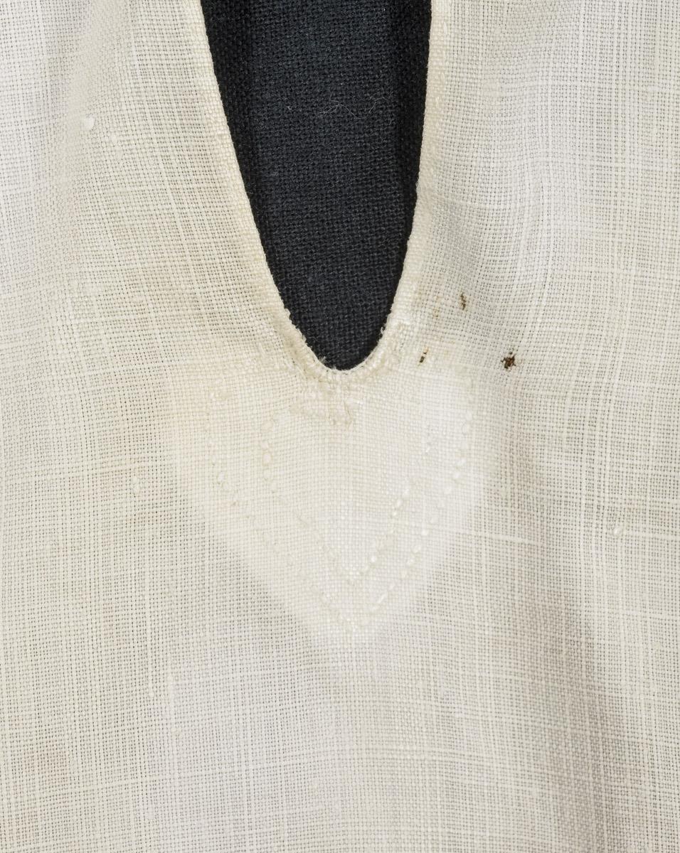 1967.1478 Shirt, detail 1, before conservation treatment