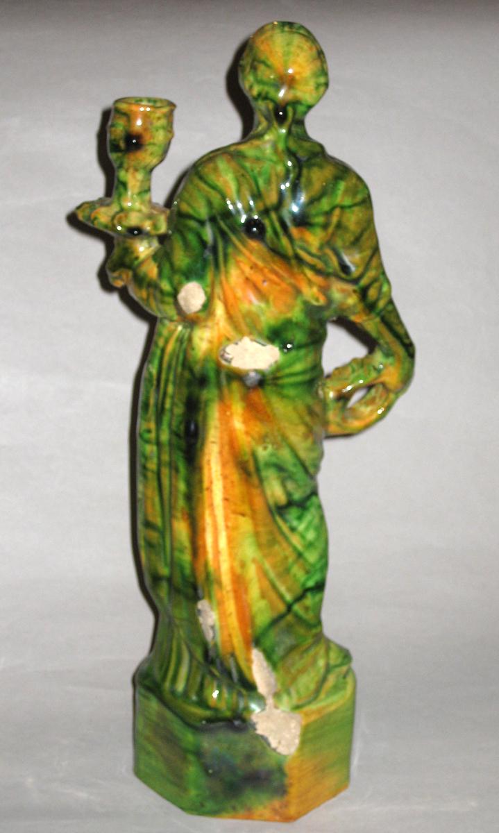 1967.1627 Candlestick figure (rear view)