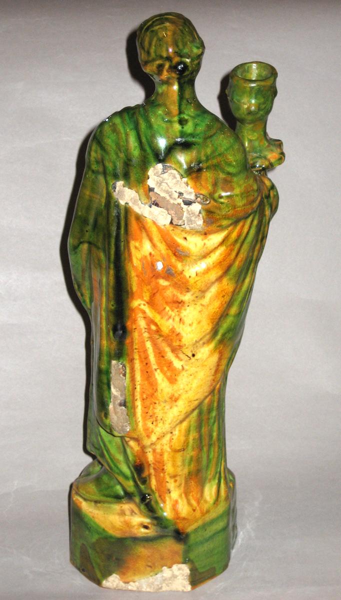 1967.1628 Candlestick figure (rear view)